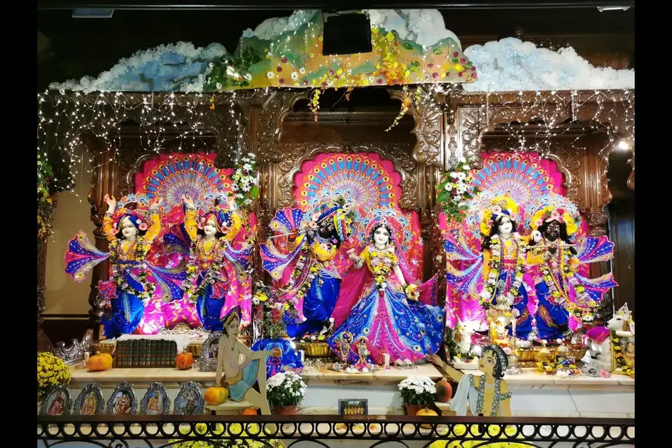 Deities surrounded by colorful festive decorations